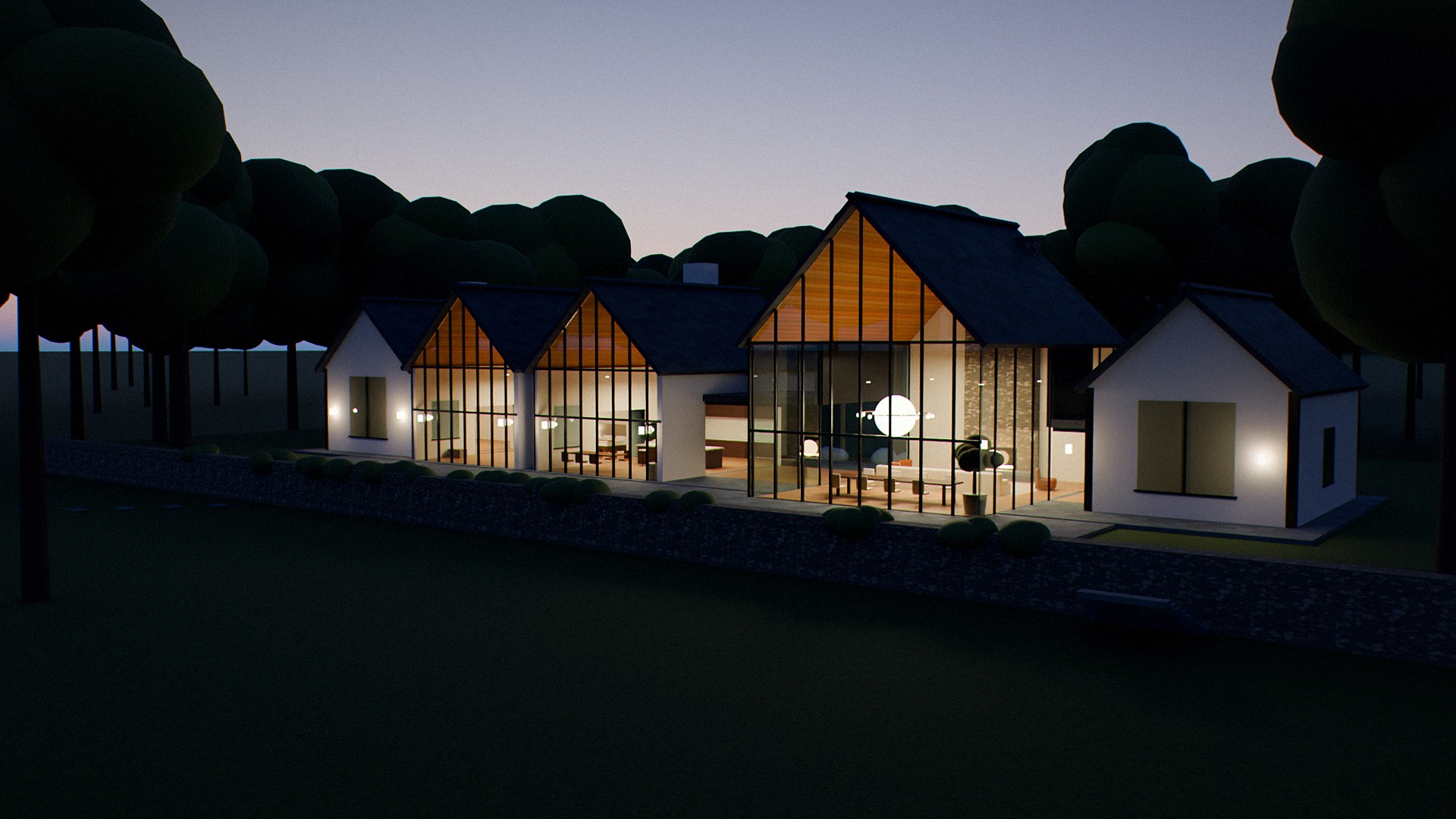 The house lit at night among the trees